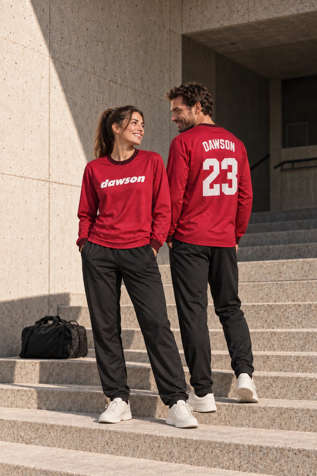 Two teammates wearing matching crimson Dawson jerseys with a team logo and player number.