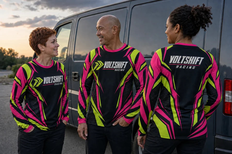 VOLTSHIFT RACING team wearing Neon Vector shirts. Evening transport stop.
