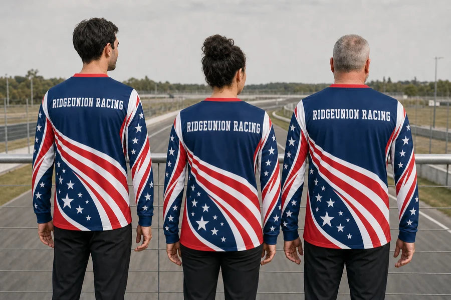 RIDGEUNION RACING team wearing Patriot Apex Run shirts. Empty-track rail overlook.